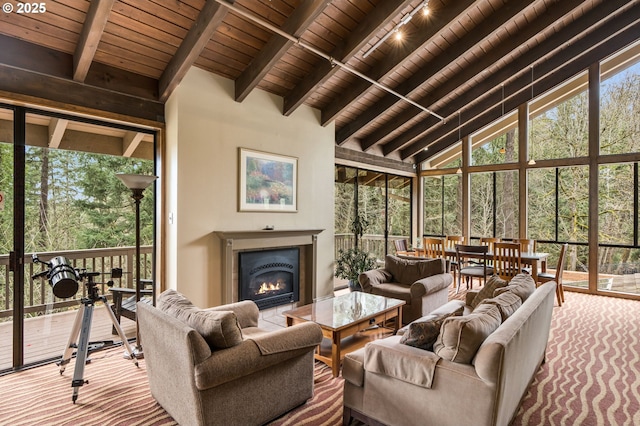 7538 SW Barnes Rd Unit H, Portland, OR 97225 - living room featuring high vaulted ceiling, wood ceiling with exposed beams, and a glass covered fireplace