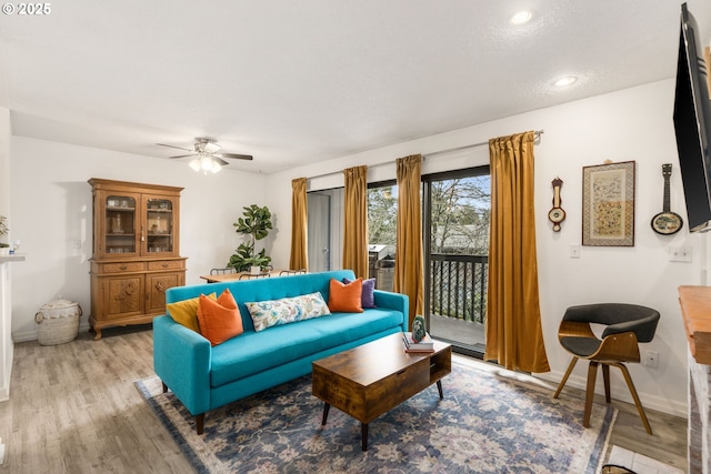 7538 SW Barnes Rd Unit H, Portland, OR 97225 - living room featuring ceiling fan, light wood-style flooring, baseboards, and recessed lighting