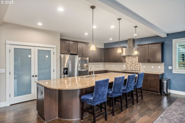13864 SE Nightingale Ave, Happy Valley, OR 97015 - kitchen featuring wall chimney exhaust hood, stainless steel appliances, dark brown cabinetry, dark wood-style flooring, and recessed lighting