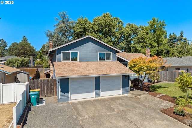 view of front of house with a shingled roof, concrete driveway, a chimney, and fence