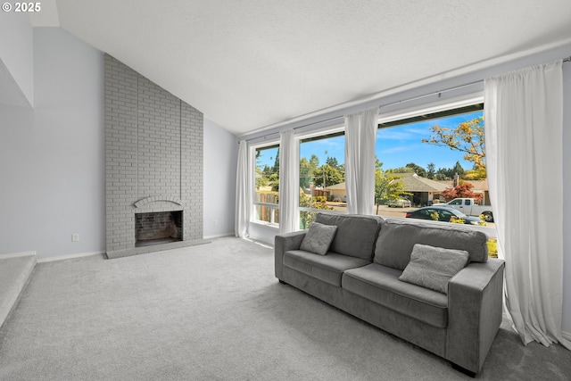 living room featuring carpet flooring, a fireplace, a textured ceiling, and baseboards