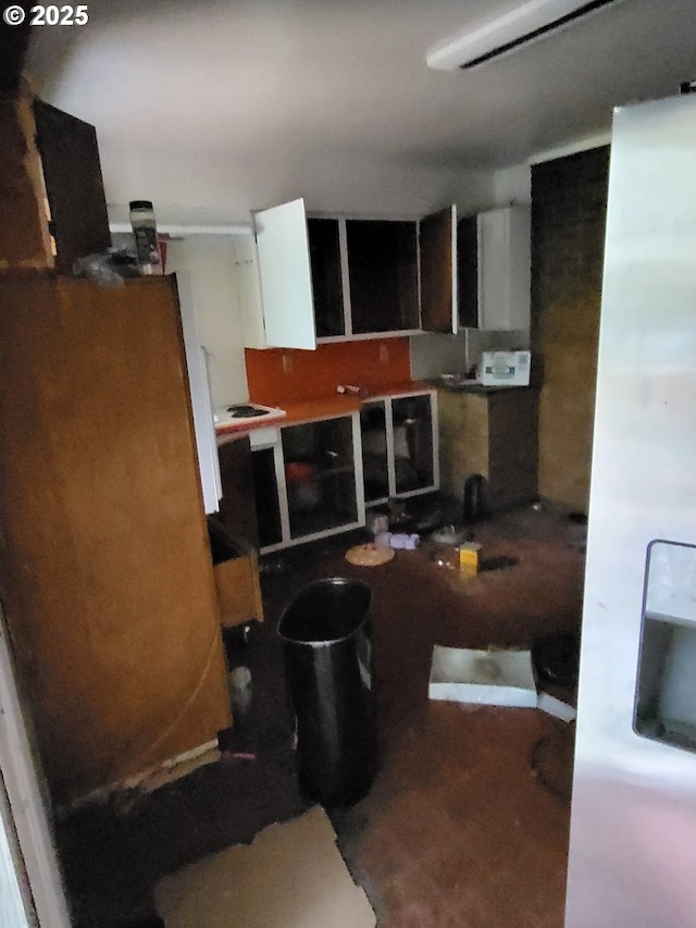 235 Bilger Creek Rd, Myrtle Creek, OR 97457 - kitchen with white cabinetry and freestanding refrigerator