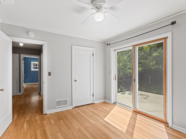 4561 NE 35th Ave, Portland, OR 97211 - unfurnished bedroom featuring access to outside, light wood-style floors, ornamental molding, and a ceiling fan