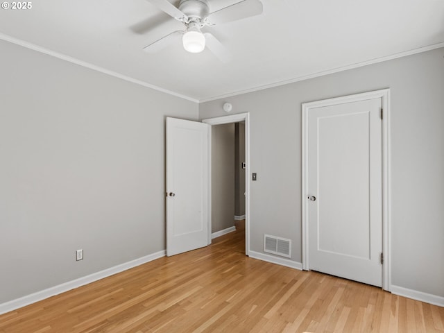 4561 NE 35th Ave, Portland, OR 97211 - unfurnished bedroom with crown molding, light wood finished floors, and a ceiling fan