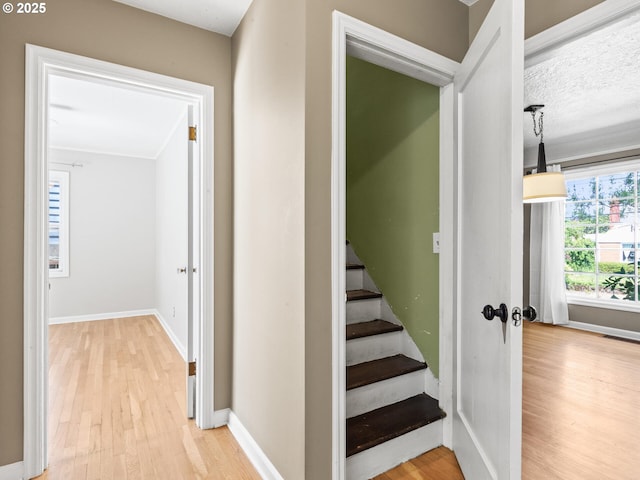 4561 NE 35th Ave, Portland, OR 97211 - stairway featuring wood finished floors and baseboards