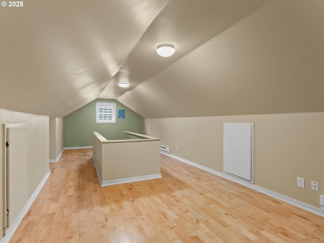 4561 NE 35th Ave, Portland, OR 97211 - additional living space featuring a baseboard heating unit, light wood finished floors, and vaulted ceiling