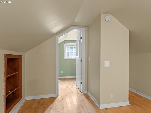 4561 NE 35th Ave, Portland, OR 97211 - additional living space featuring light wood-style flooring and vaulted ceiling