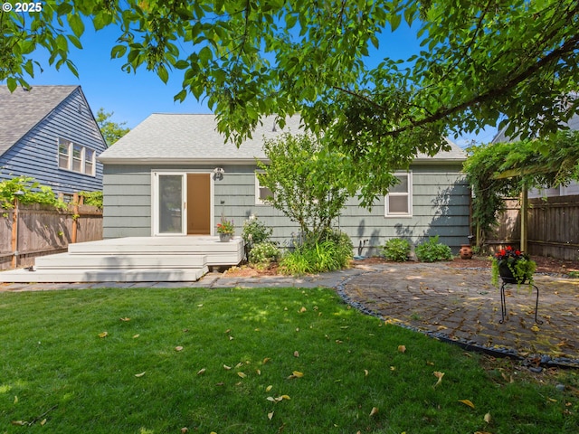 4561 NE 35th Ave, Portland, OR 97211 - rear view of property with a fenced backyard, roof with shingles, and a deck