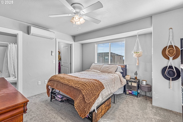 bedroom featuring ceiling fan, carpet, and a wall mounted air conditioner