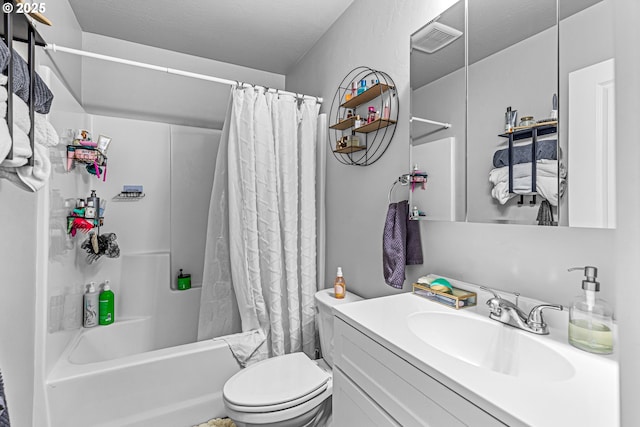 full bathroom featuring shower / bath combination with curtain, toilet, a textured ceiling, and vanity