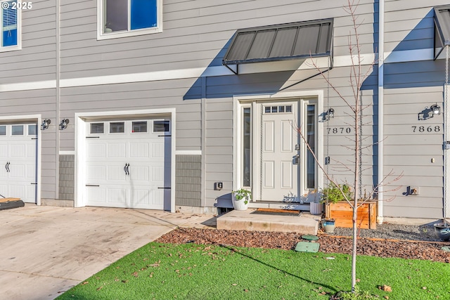 property entrance with a garage