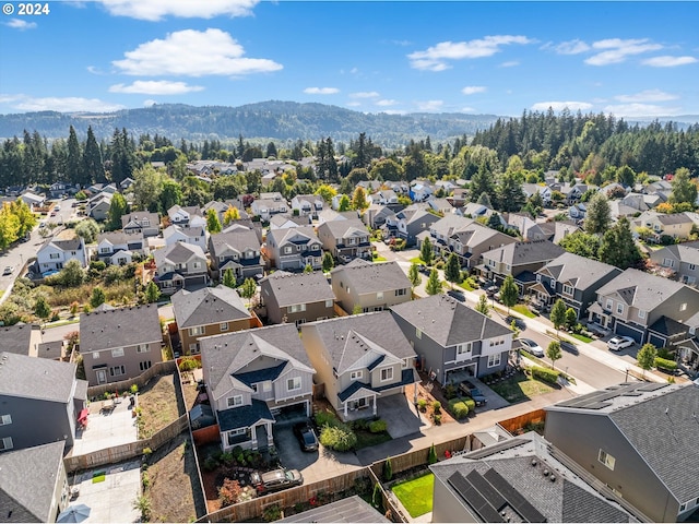 birds eye view of property featuring a mountain view and a residential view