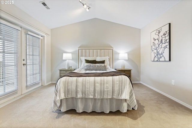 bedroom featuring access to exterior, light colored carpet, baseboards, and lofted ceiling