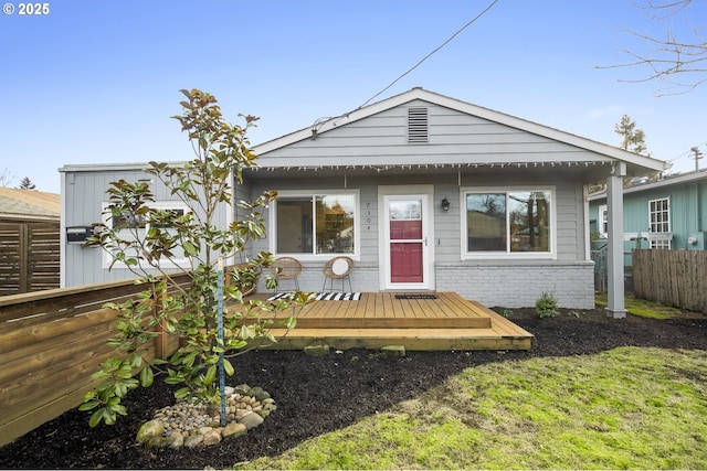 view of front facade featuring a wooden deck