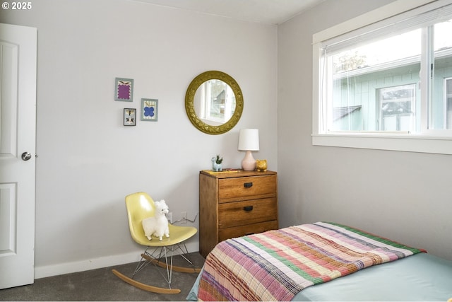 bedroom with dark colored carpet