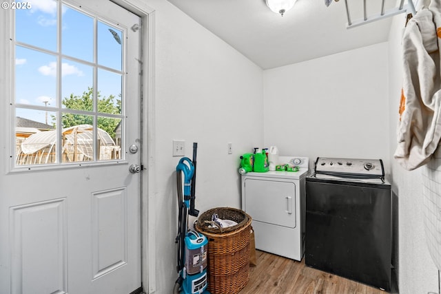 185 N Seneca Rd, Eugene, OR 97402 - laundry room with washer and dryer, plenty of natural light, and light wood-style flooring