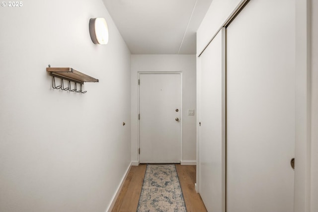 1919 NW Hoyt St Unit 104, Portland, OR 97209 - doorway featuring light wood-style floors and baseboards