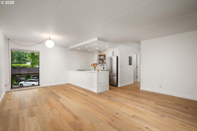 1919 NW Hoyt St Unit 104, Portland, OR 97209 - unfurnished living room with light wood-style floors and recessed lighting