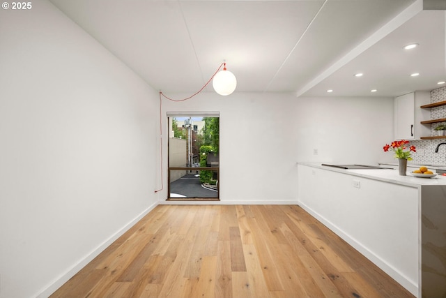1919 NW Hoyt St Unit 104, Portland, OR 97209 - unfurnished dining area featuring light wood-style floors and recessed lighting