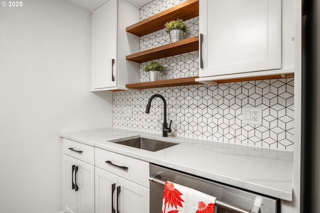 1919 NW Hoyt St Unit 104, Portland, OR 97209 - kitchen with open shelves, dishwasher, decorative backsplash, and white cabinetry