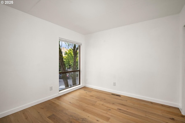 1919 NW Hoyt St Unit 104, Portland, OR 97209 - empty room featuring baseboards and light wood finished floors