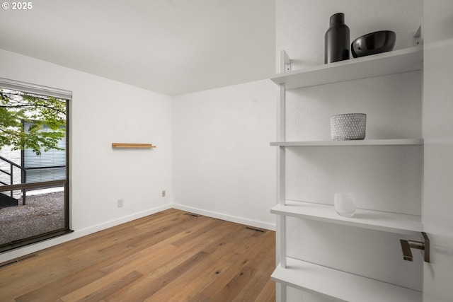 1919 NW Hoyt St Unit 104, Portland, OR 97209 - empty room with wood finished floors and baseboards