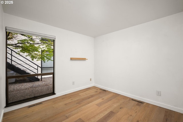 1919 NW Hoyt St Unit 104, Portland, OR 97209 - spare room with baseboards and wood finished floors