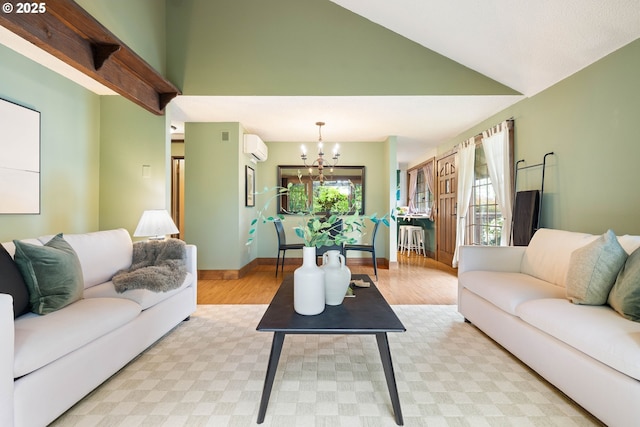 15787 SW Village Cir, Beaverton, OR 97007 - living room featuring light wood finished floors, a chandelier, a wall mounted AC, high vaulted ceiling, and baseboards