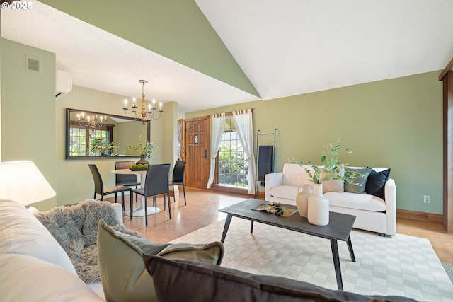 15787 SW Village Cir, Beaverton, OR 97007 - living room with a chandelier, a wall mounted air conditioner, lofted ceiling, light wood-style flooring, and baseboards