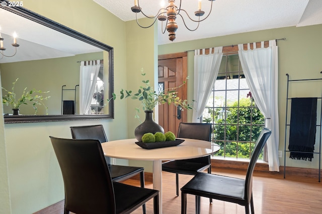 15787 SW Village Cir, Beaverton, OR 97007 - dining area featuring a chandelier and wood finished floors