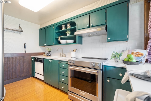 15787 SW Village Cir, Beaverton, OR 97007 - kitchen featuring stainless steel electric range, under cabinet range hood, dishwasher, a sink, and light wood-type flooring
