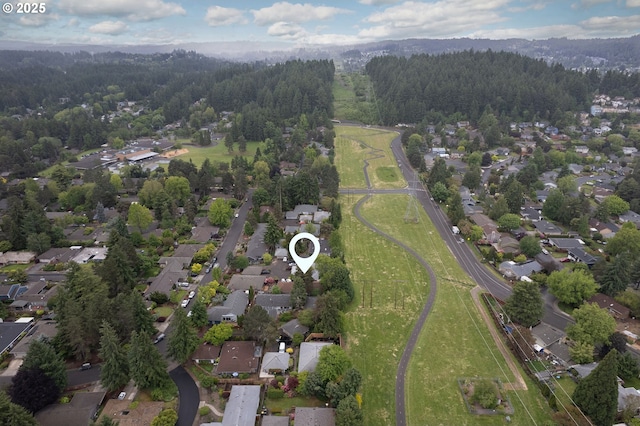15787 SW Village Cir, Beaverton, OR 97007 - aerial overview of property's location featuring a forest and nearby suburban area