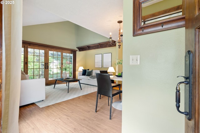 15787 SW Village Cir, Beaverton, OR 97007 - dining room featuring high vaulted ceiling, french doors, and wood finished floors