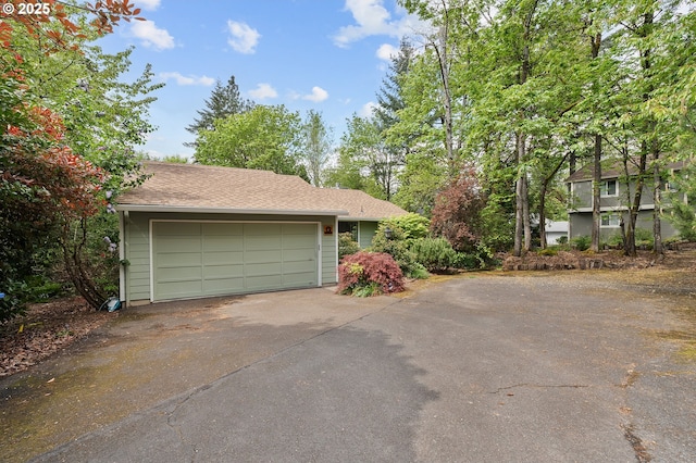 garage featuring driveway