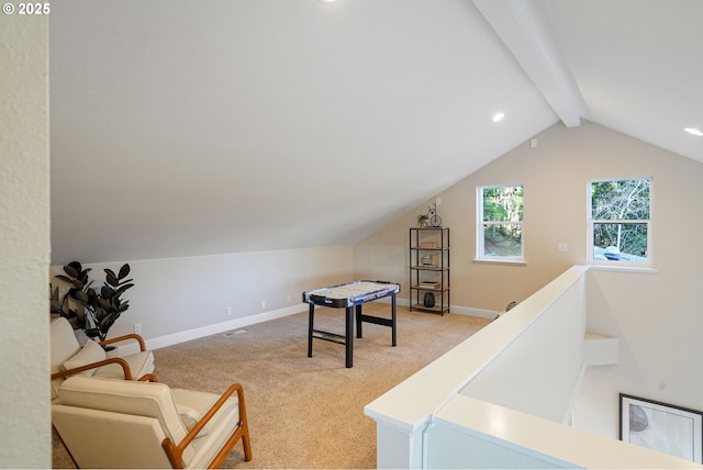 rec room featuring light colored carpet and lofted ceiling with beams