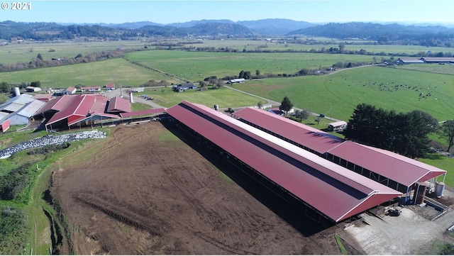 drone / aerial view featuring a rural view and a mountain view