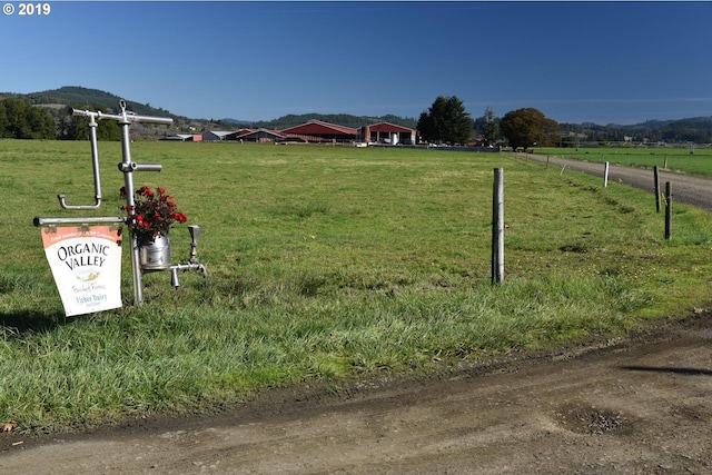 view of property's community with a lawn