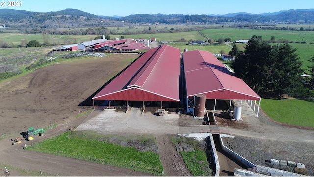 birds eye view of property featuring a mountain view and a rural view