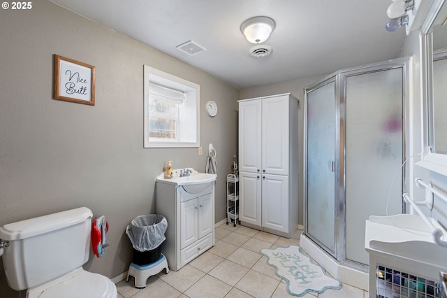 bathroom featuring visible vents, tile patterned flooring, toilet, and a shower stall
