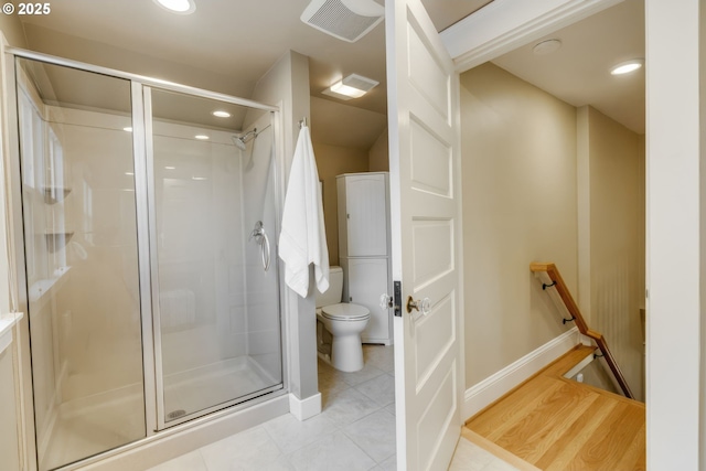 full bath with tile patterned floors, toilet, recessed lighting, and a shower stall