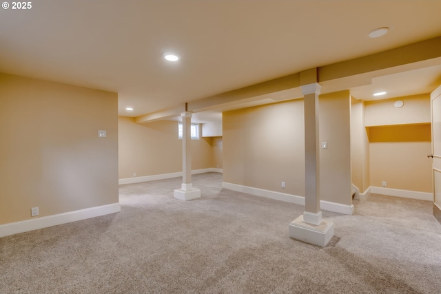 below grade area featuring recessed lighting, baseboards, and light carpet