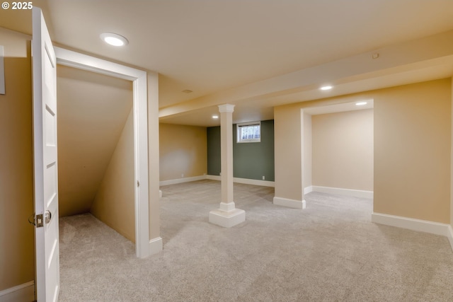 below grade area featuring recessed lighting, baseboards, and light carpet