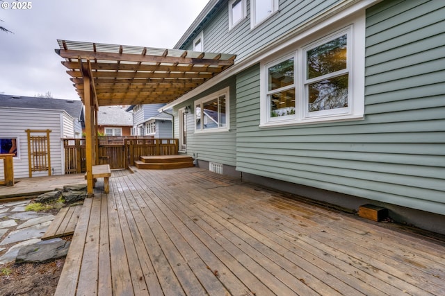 wooden deck featuring a pergola