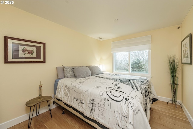 bedroom featuring hardwood / wood-style flooring