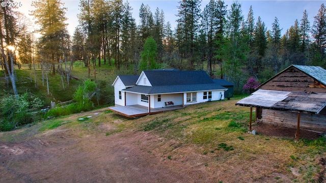 932 Zelinski Rd, Goldendale, WA 98620 - back of property featuring dirt driveway and a wooden deck