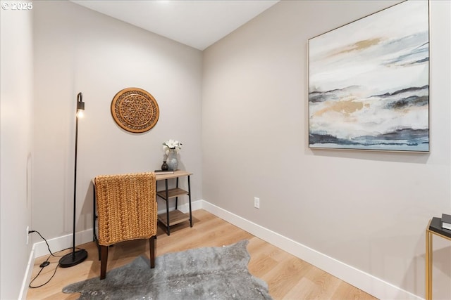 living area with hardwood / wood-style floors