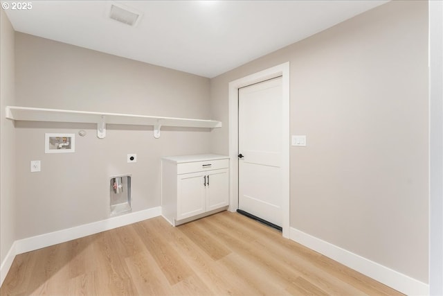 washroom with hookup for a washing machine, hookup for an electric dryer, and light wood-type flooring