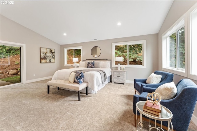 bedroom with lofted ceiling and light carpet