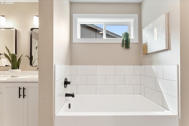 bathroom featuring vanity and a bathing tub