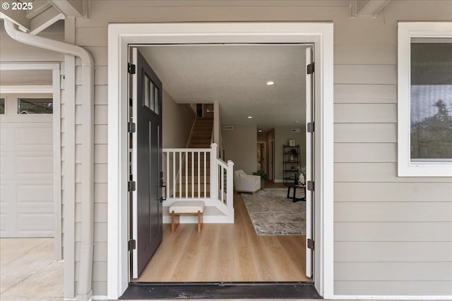 entrance to property featuring a garage